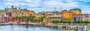 Colourful buildings of Genoa looking over the marina with yachts docked