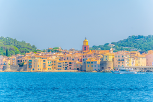 St Tropez colourful buildings with clear ocean water and skies