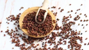 Sichuan peppercorns on small wooden dish