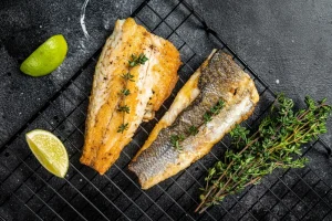 Sea Bass beside lemon and lime.